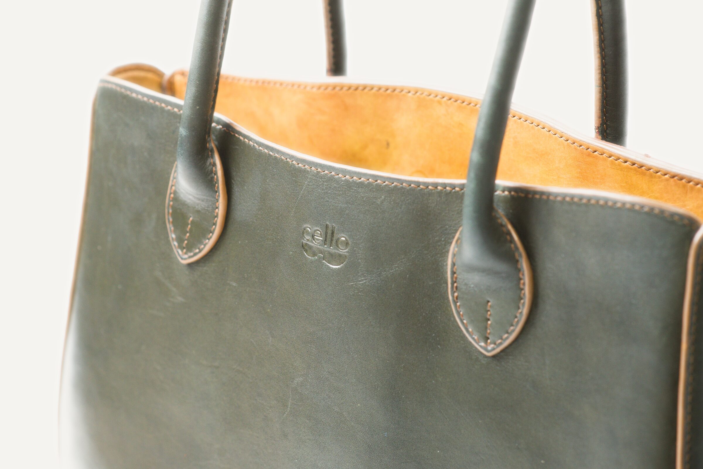 Close view of the handles and the stamped mark, worn soft by years of hands