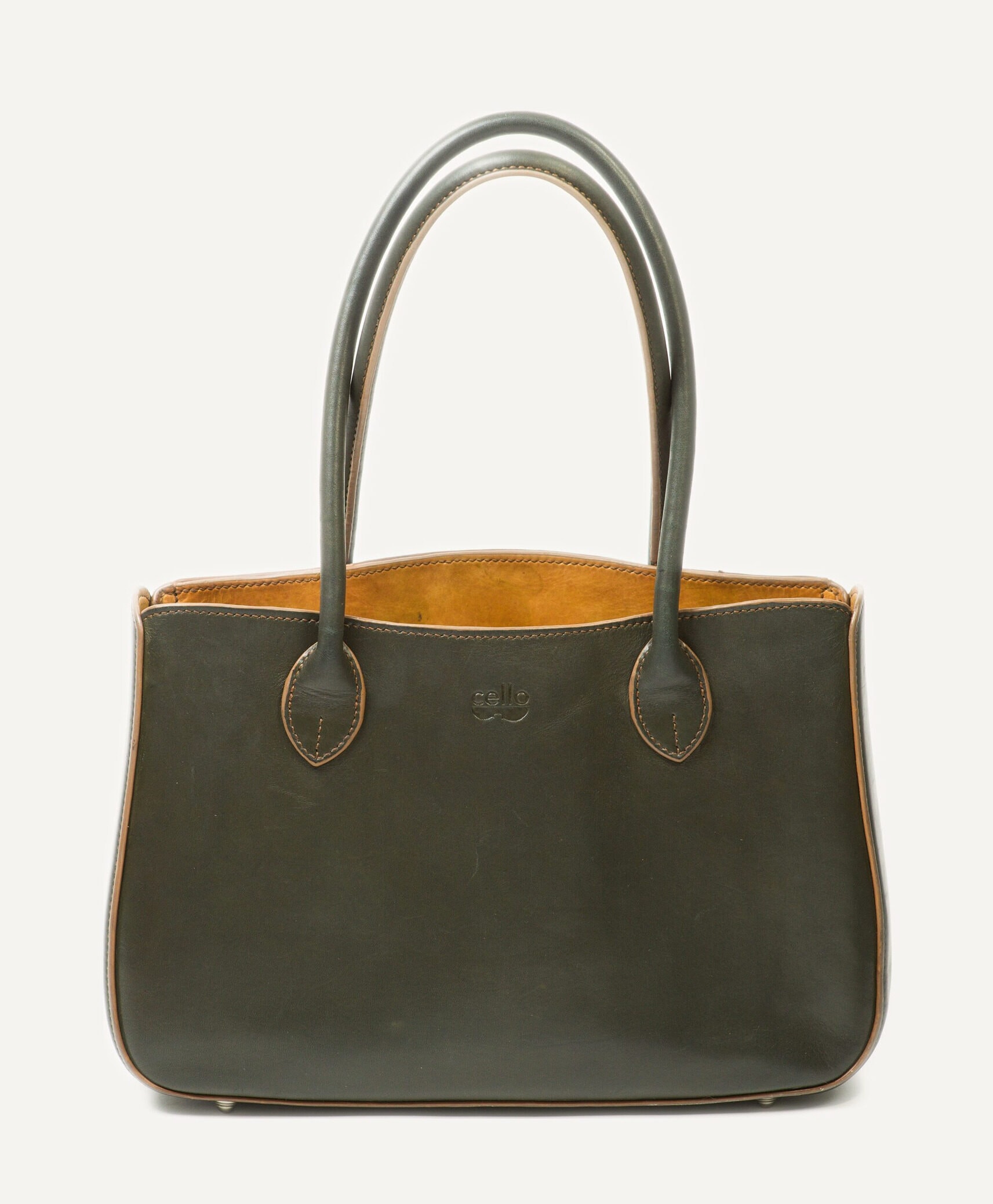 The same Alto seven years on, the green deepened almost to charcoal and the leather softened